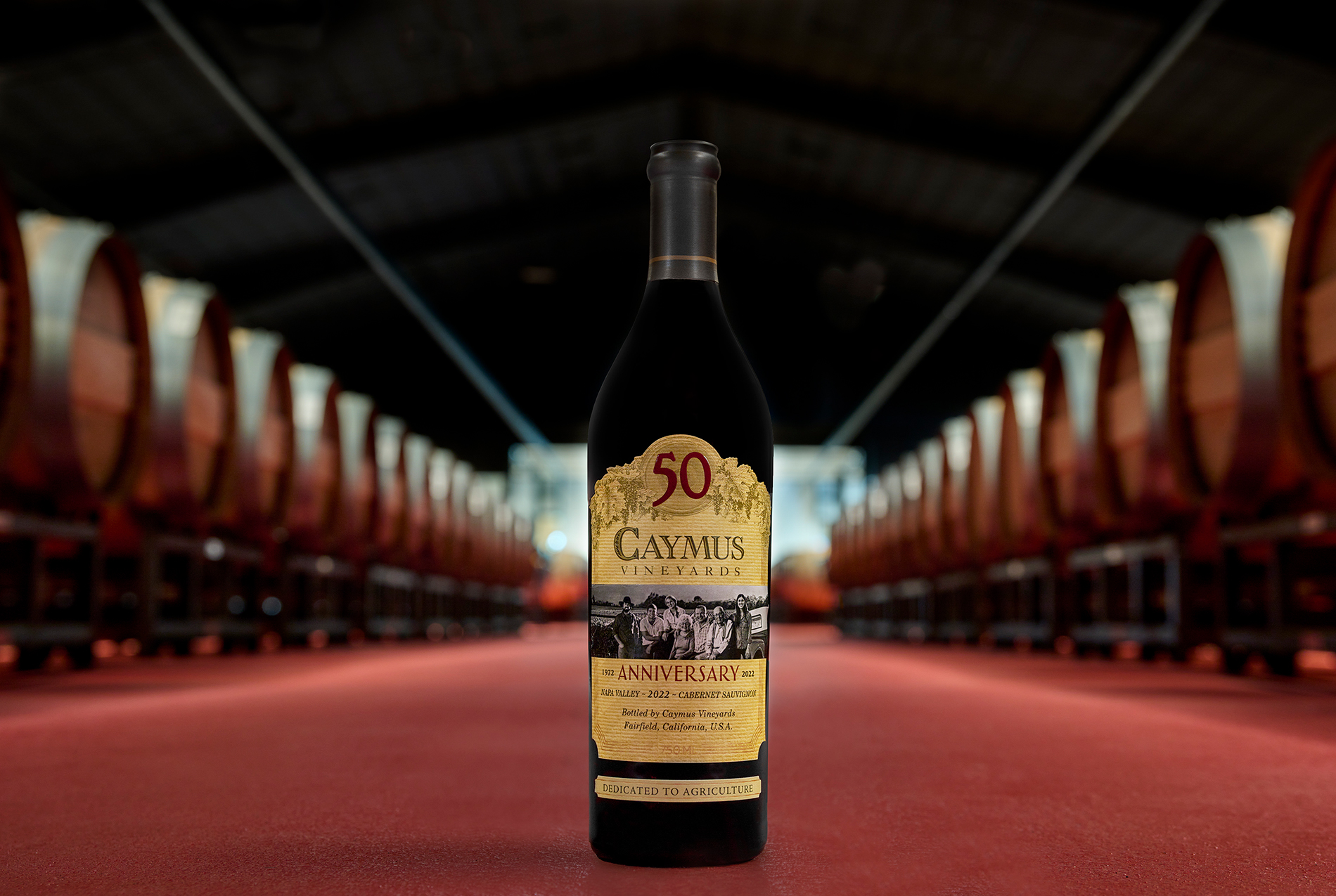 Bottle of Cabernet Sauvignon in a barrel room.